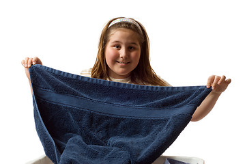 Image showing Girl Folding Towels