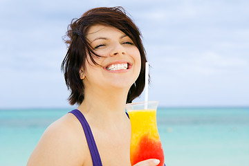 Image showing happy woman with colorful cocktail