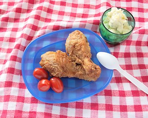 Image showing fried chicken legs with potato salad