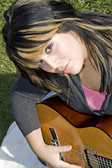 Image showing Girl Playing a Guitar