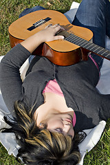 Image showing Girl Playing a Guitar