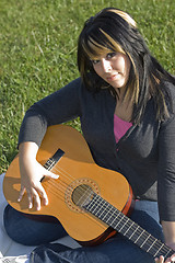 Image showing Girl Playing a Guitar