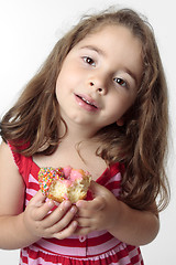 Image showing Smiling girl eating snack