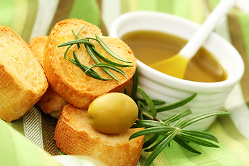 Image showing baguette and olive oil