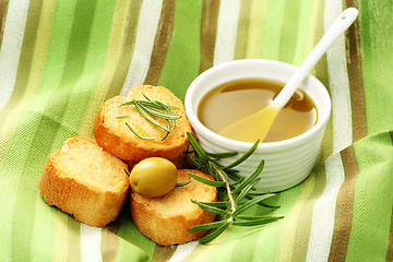 Image showing baguette and olive oil