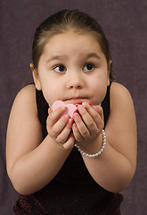 Image showing Child Holding Heart Pieces