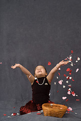 Image showing Child Throwing Confetti