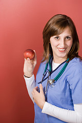 Image showing Nurse With An Apple