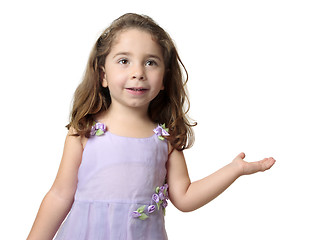 Image showing Pretty smiling girl showing hand outstretched