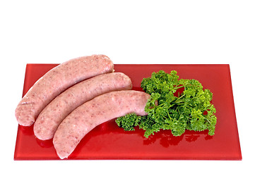 Image showing Sausages on red plate