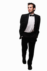 Image showing Man in tuxedo stepping out