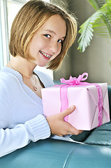 Image showing Teenage girl with present