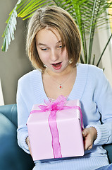 Image showing Teenage girl with present