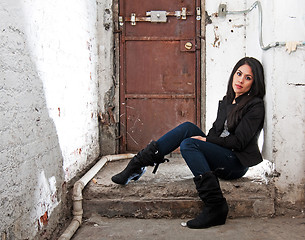 Image showing Girl sitting in basement