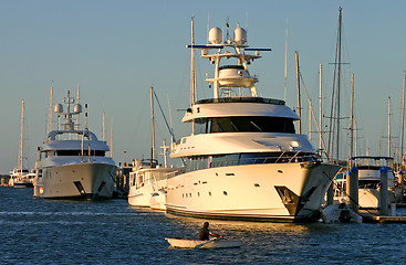 Image showing Row Boat VS Superyacht