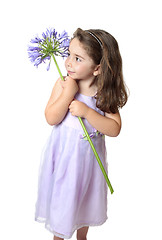 Image showing Pretty girl holding a flower