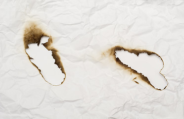 Image showing burnt holes 