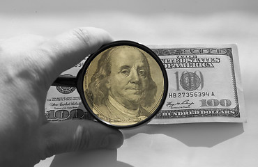 Image showing dollars and magnifying glass