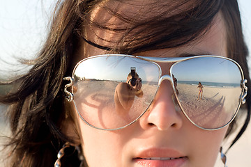 Image showing Reflexion of the photographer in model glasses