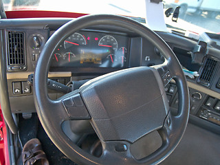 Image showing Steering wheel and instrument panel of a truck