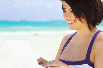 Image showing woman with laptop computer on the beach