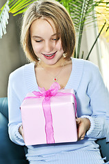 Image showing Teenage girl with present