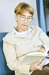 Image showing Old woman reading book