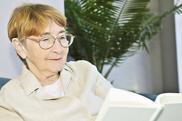 Image showing Old woman reading book