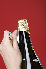 Image showing Opening champagne bottle