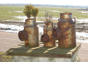 Image showing Milk cans 50 years old.