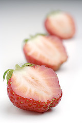 Image showing three halfs of strawberries