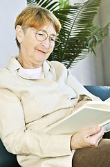 Image showing Old woman reading book