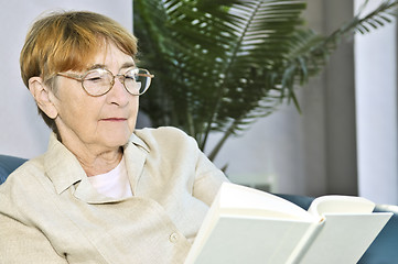 Image showing Old woman reading book