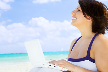 Image showing woman with laptop computer on the beach