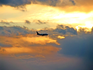 Image showing Sunset sky and airplane