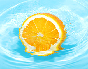 Image showing orange in splash