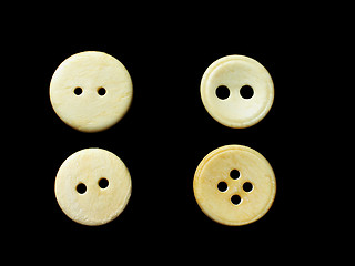 Image showing four white buttons