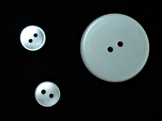 Image showing three white buttons