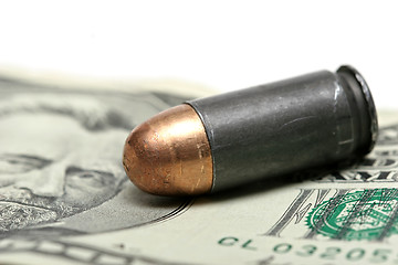 Image showing bullet over dollars