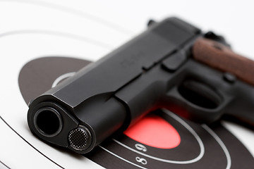 Image showing gun over bullseye