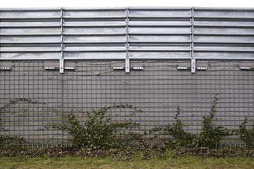 Image showing High concrete and aluminum wall