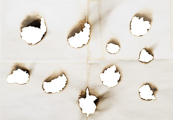 Image showing holes in a paper