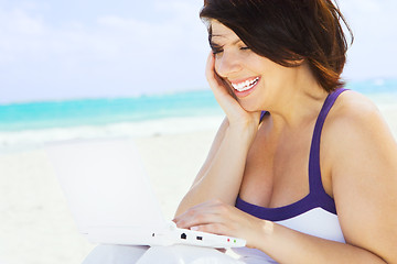 Image showing woman with laptop computer on the beach