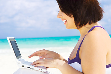 Image showing woman with laptop computer on the beach