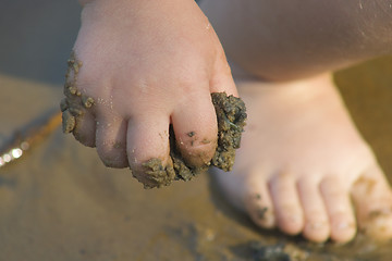 Image showing child's hand with sand