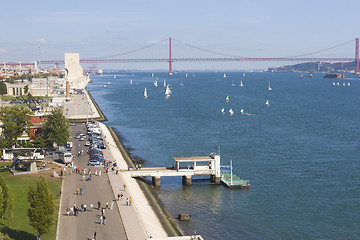 Image showing wide river with yachts and modern bridge