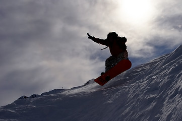 Image showing snowboarder's flying