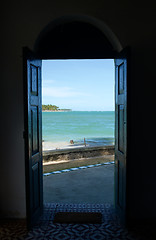 Image showing Tropical beach in Brazil seen through a window door
