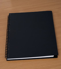 Image showing spiral notebook on a table