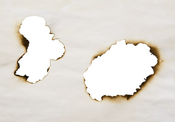 Image showing two burnt holes